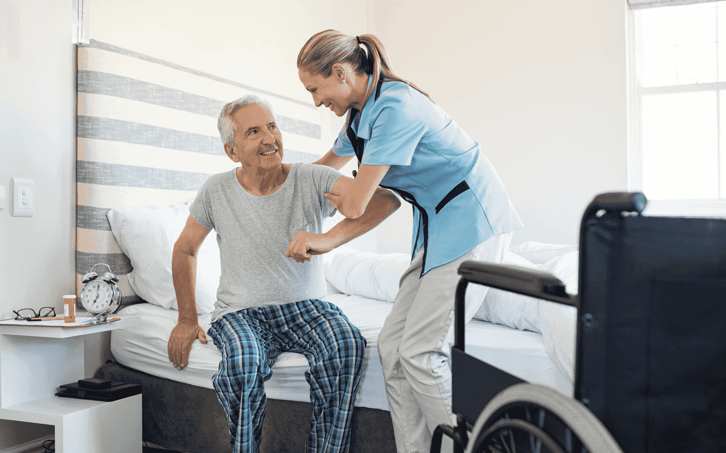 nurse-helping-old-patient-get-up